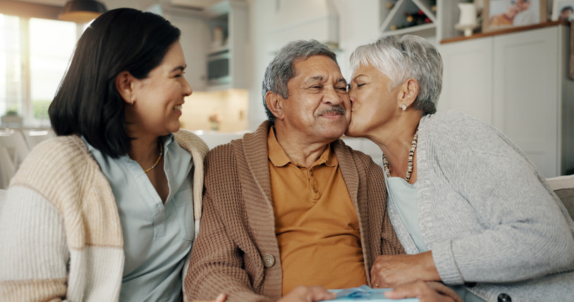 7 Tips for Choosing the Right Memory Care Community as a Family A wife kissing her husband's cheek